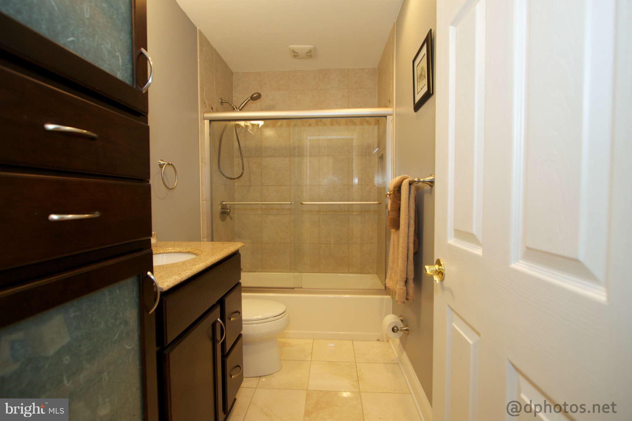 1315 Murgatroyd Road Fallston, MD 21047 - Photo 22 of 30 a bathroom with a glass shower door