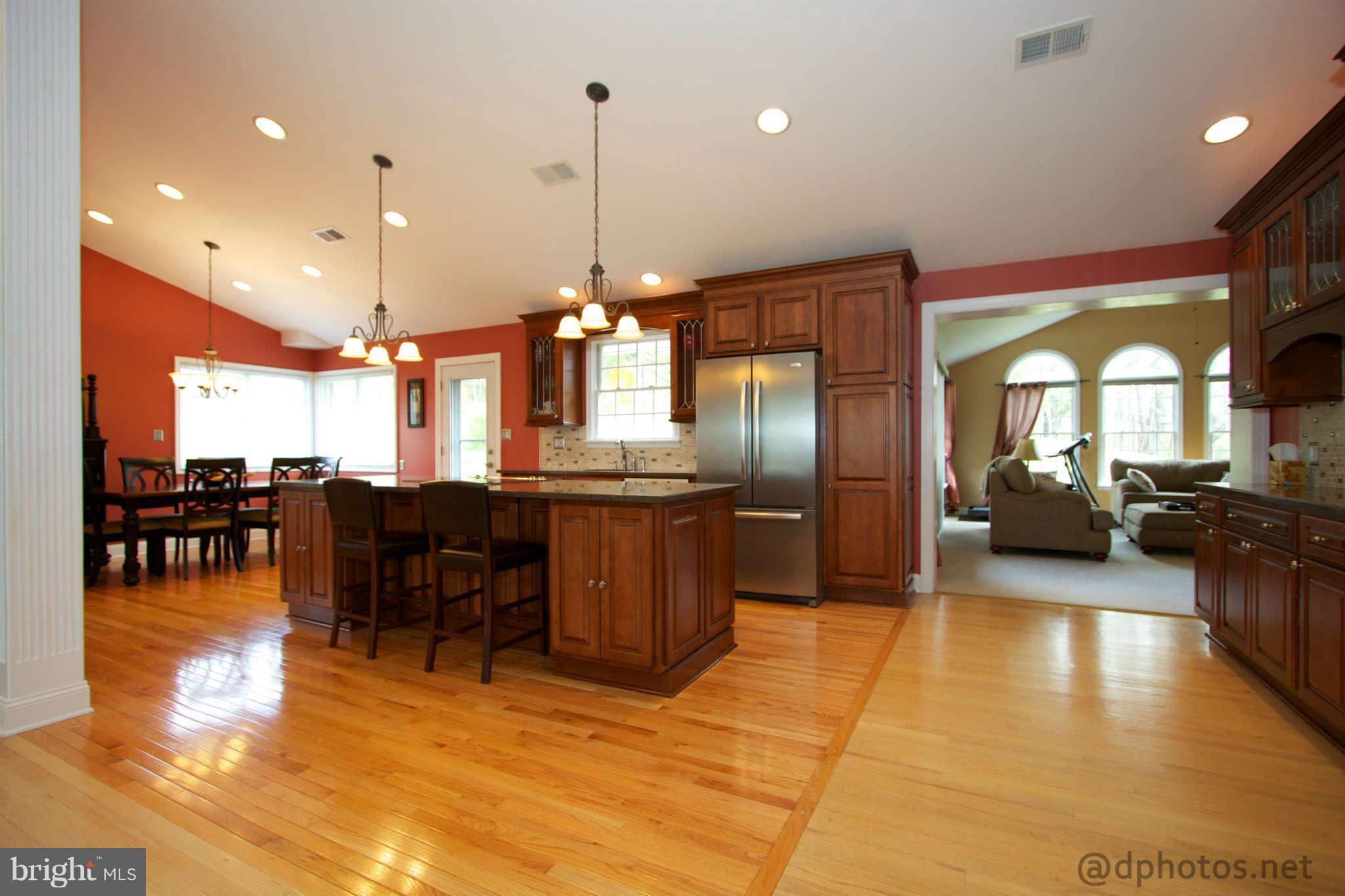 1315 Murgatroyd Road Fallston, MD 21047 - Photo 6 of 30 a view of a dining room and livingroom with furniture wooden floor a chandelier