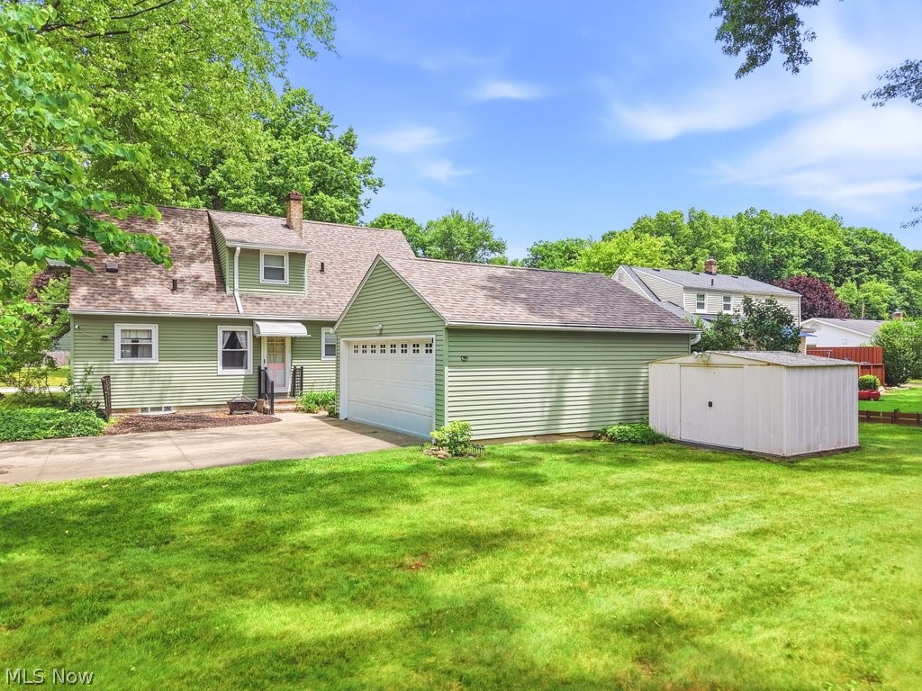 161 Pinehurst Road Munroe Falls, OH 44262 - Photo 35 of 40 Backyard with a garage and driveway