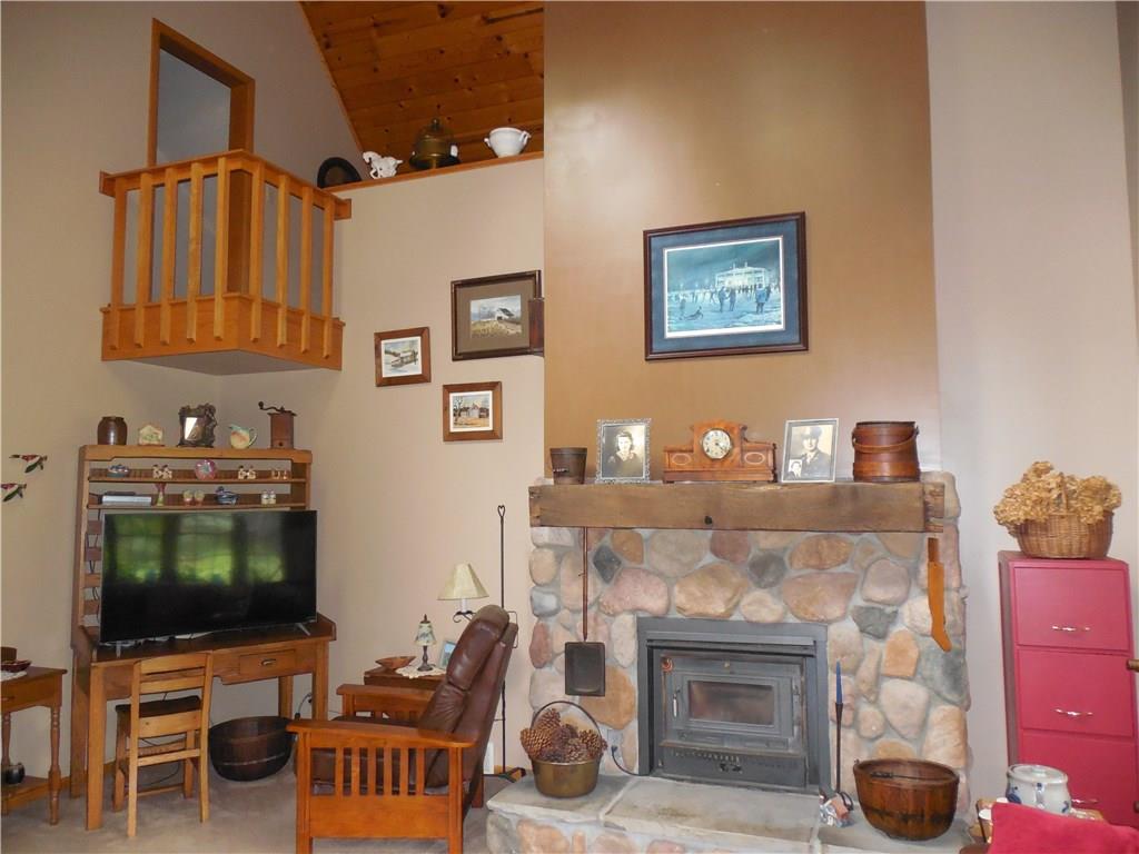 541 Pulaski Road Pulaski, PA 16143 - Photo 18 of 24 The stone fireplace and loft add to the beautiful family room.