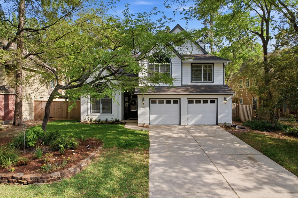 50 East Greywing Circle Spring, TX 77382 - Photo 2 of 37 Welcoming front yard with a neatly landscaped garden bed. Ideal for anyone seeking a peaceful, suburban setting.
