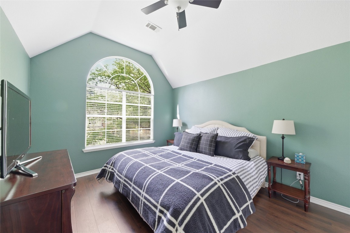 50 East Greywing Circle Spring, TX 77382 - Photo 25 of 37 This cozy bedroom features a vaulted ceiling, a large arched window with natural light.