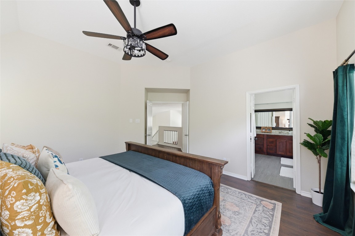 50 East Greywing Circle Spring, TX 77382 - Photo 27 of 37 Features an en-suite bathroom and wood flooring, creating a warm, inviting atmosphere.