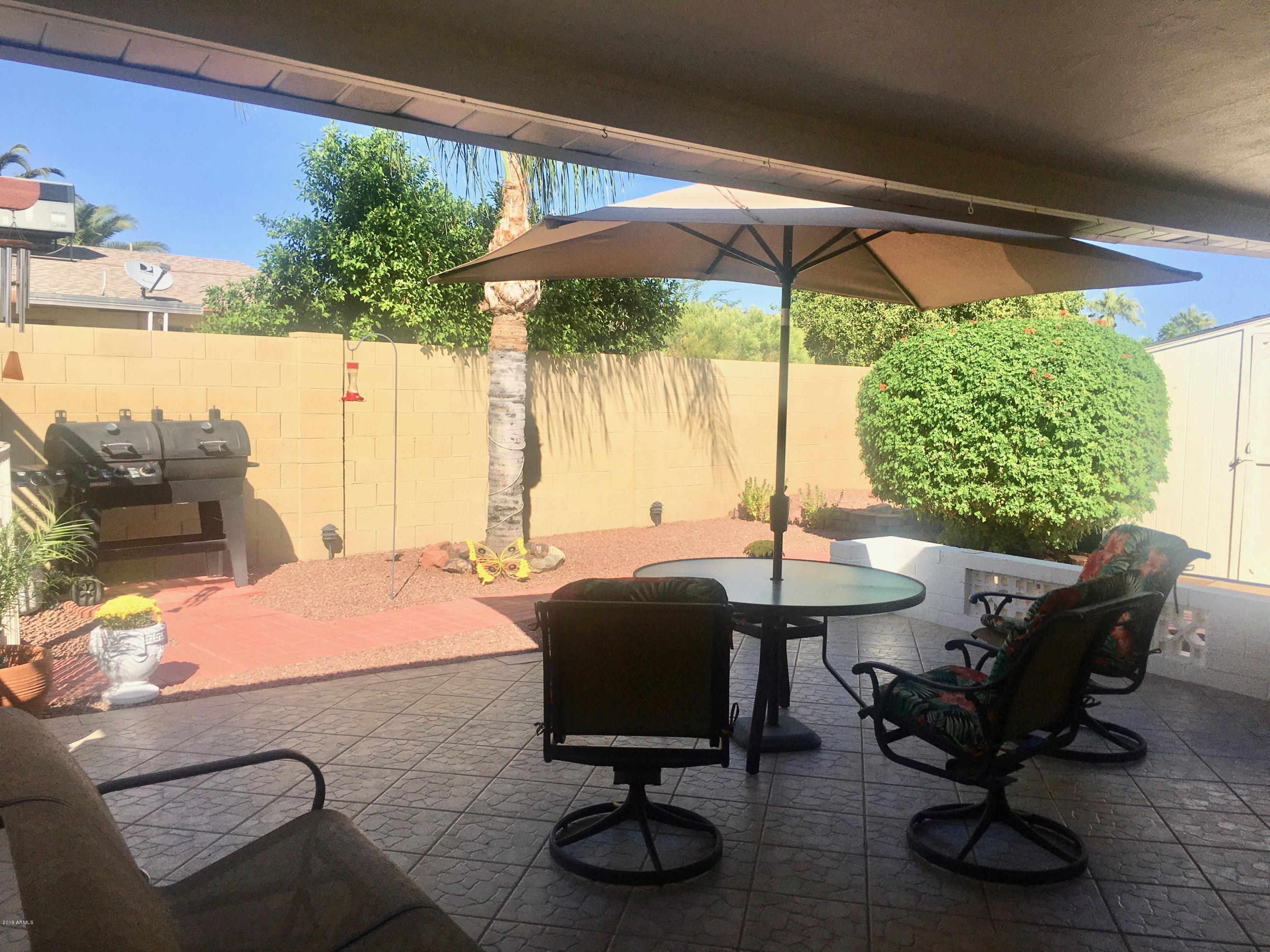 5402 East Decatur Street Mesa, AZ 85205 - Photo 32 of 37 a view of an outdoor sitting area with furniture and a tub