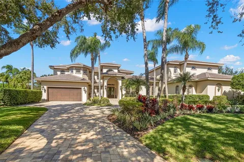 a front view of a house with a garden and a yard
