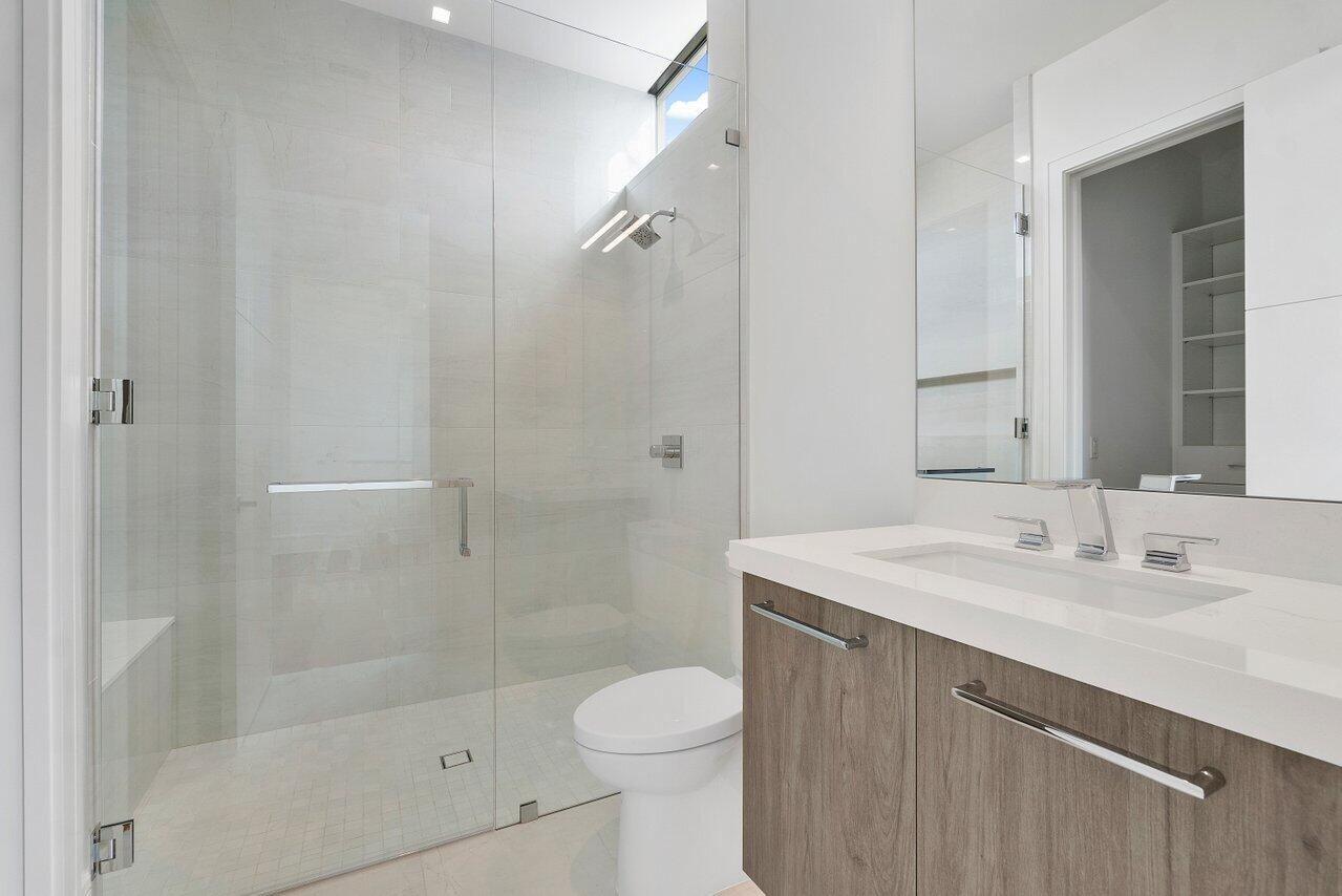 320 Northeast Wavecrest Way Boca Raton, FL 33432 - Photo 30 of 48 a bathroom with a sink toilet and shower