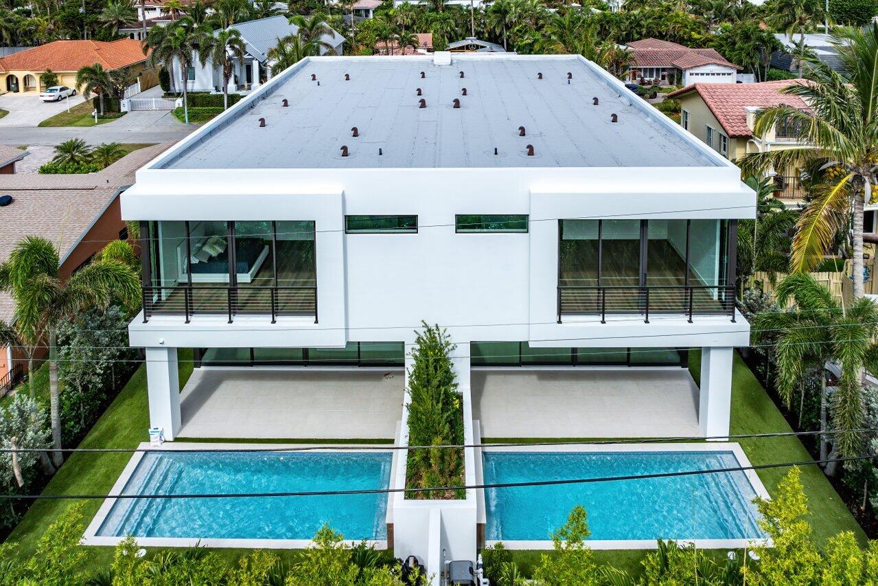 320 Northeast Wavecrest Way Boca Raton, FL 33432 - Photo 44 of 48 a front view of house with yard