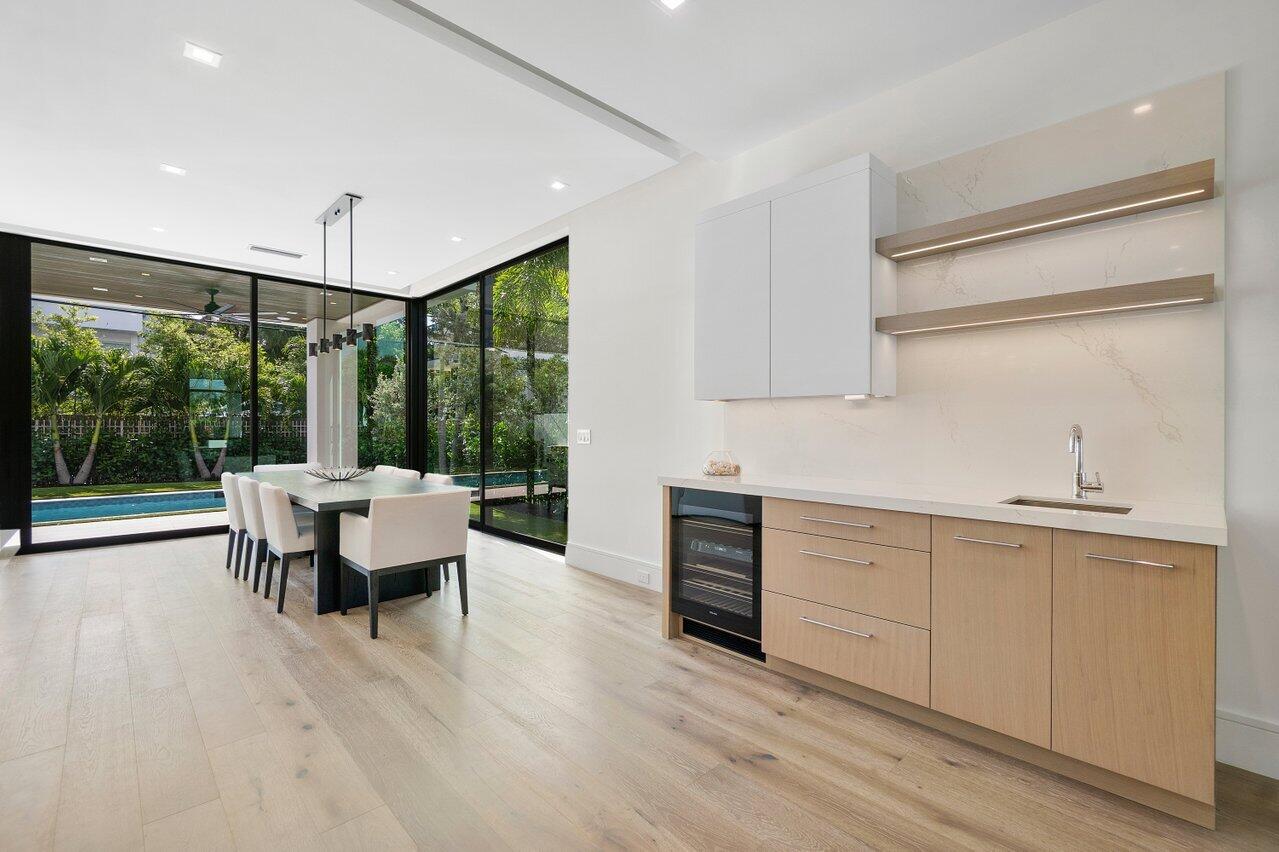 320 Northeast Wavecrest Way Boca Raton, FL 33432 - Photo 9 of 48 a living room with furniture and large windows