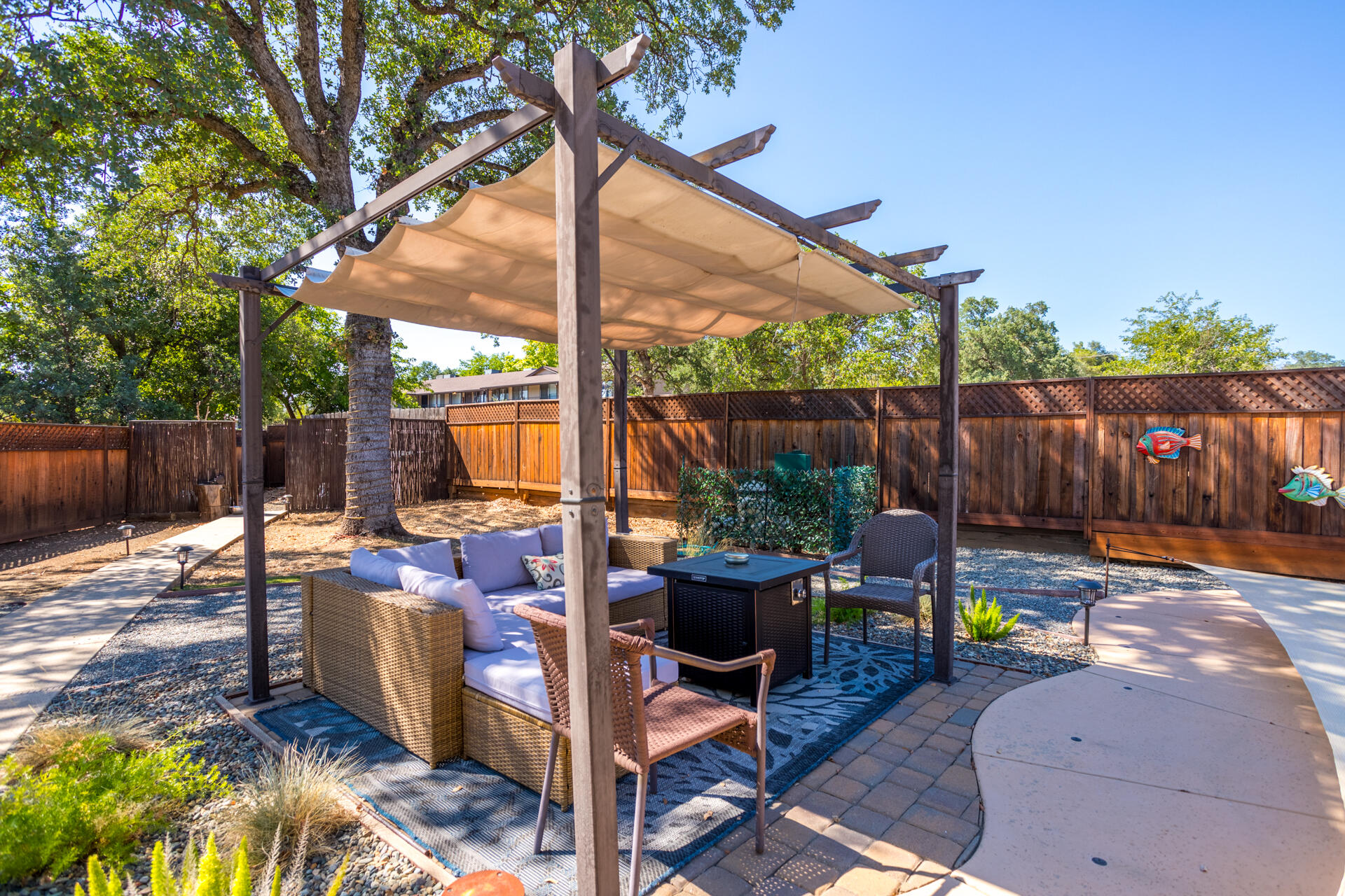 2766 Robert Court Redding, CA 96002 - Photo 17 of 28 a view of backyard with furniture and outdoor seating