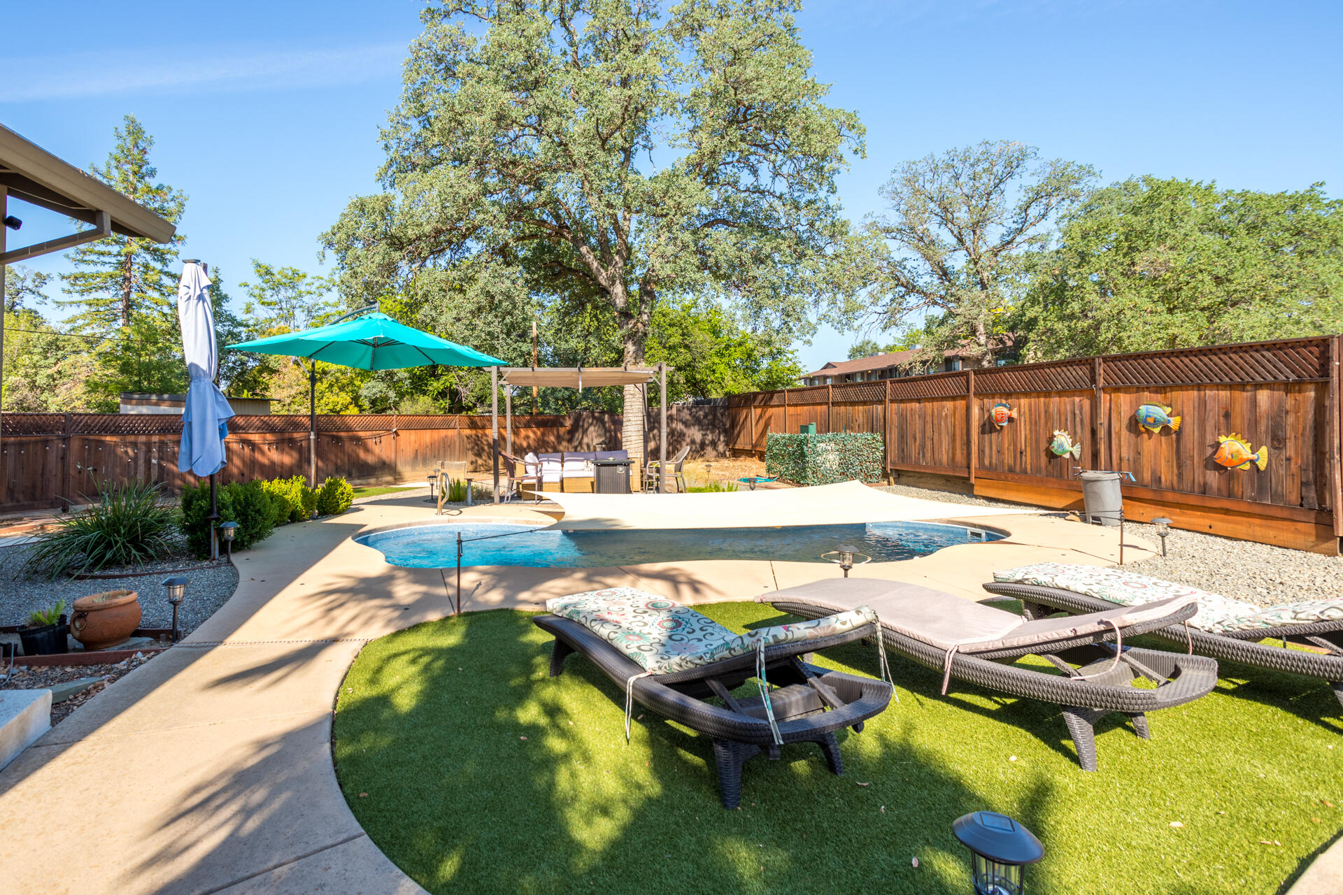 2766 Robert Court Redding, CA 96002 - Photo 2 of 28 a view of a swimming pool with a patio