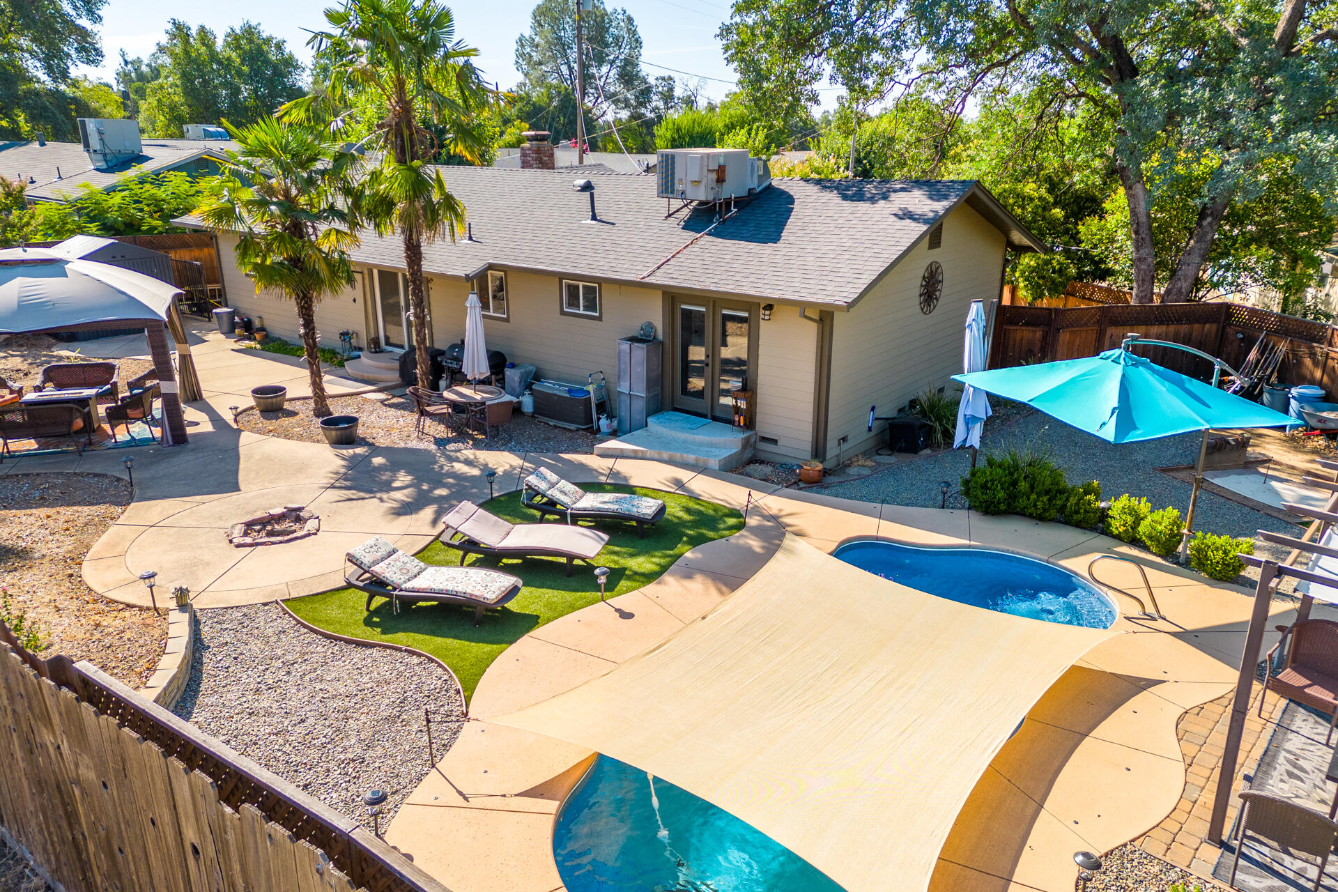 2766 Robert Court Redding, CA 96002 - Photo 23 of 28 a view of a house with swimming pool and sitting area