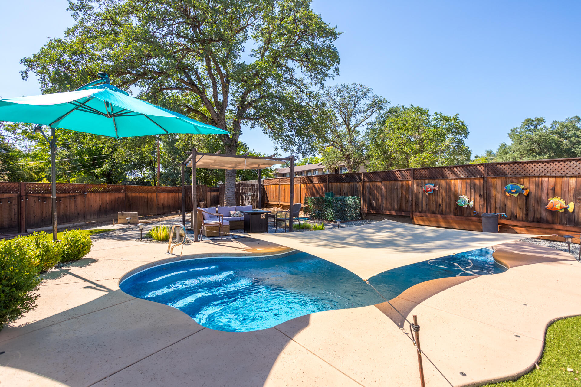 2766 Robert Court Redding, CA 96002 - Photo 24 of 28 a view of a backyard with swimming pool and furniture