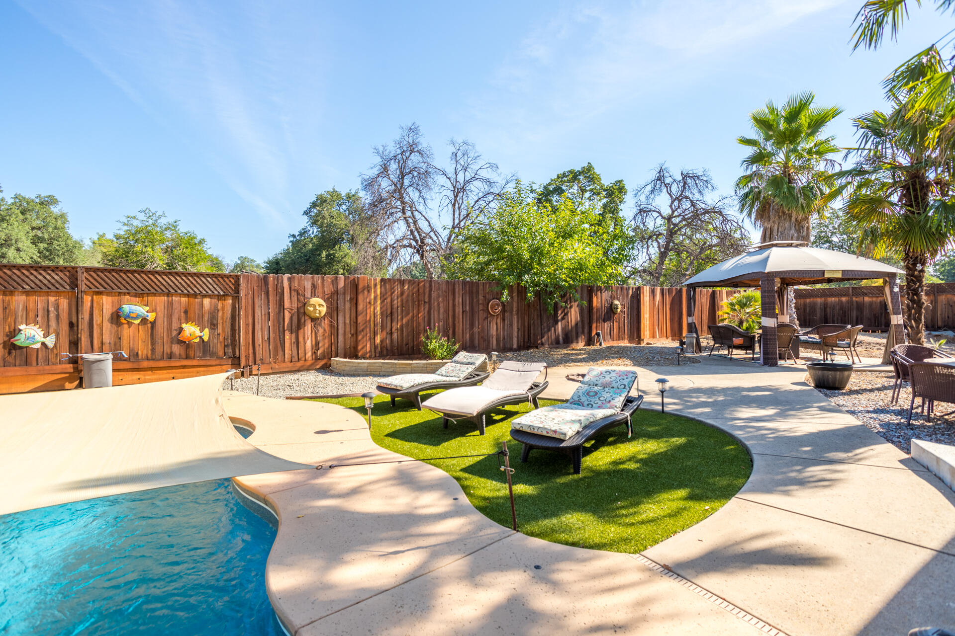 2766 Robert Court Redding, CA 96002 - Photo 25 of 28 a view of swimming pool with outdoor seating and plants