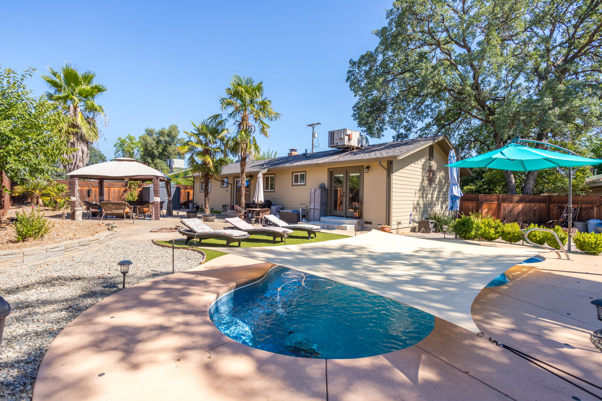 2766 Robert Court Redding, CA 96002 - Photo 26 of 28 a swimming pool with outdoor seating and yard