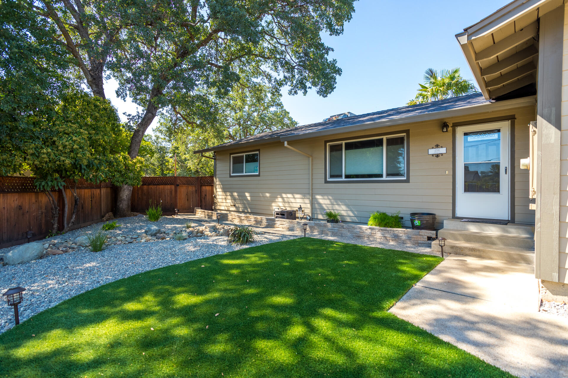 2766 Robert Court Redding, CA 96002 - Photo 28 of 28 a front view of house with a garden and patio