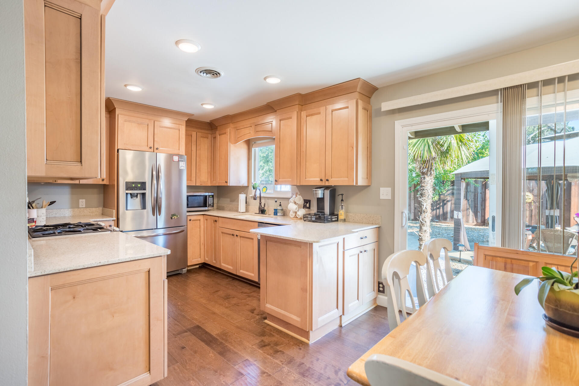 2766 Robert Court Redding, CA 96002 - Photo 9 of 28 a open kitchen with stainless steel appliances granite countertop a stove refrigerator and a sink with granite countertops