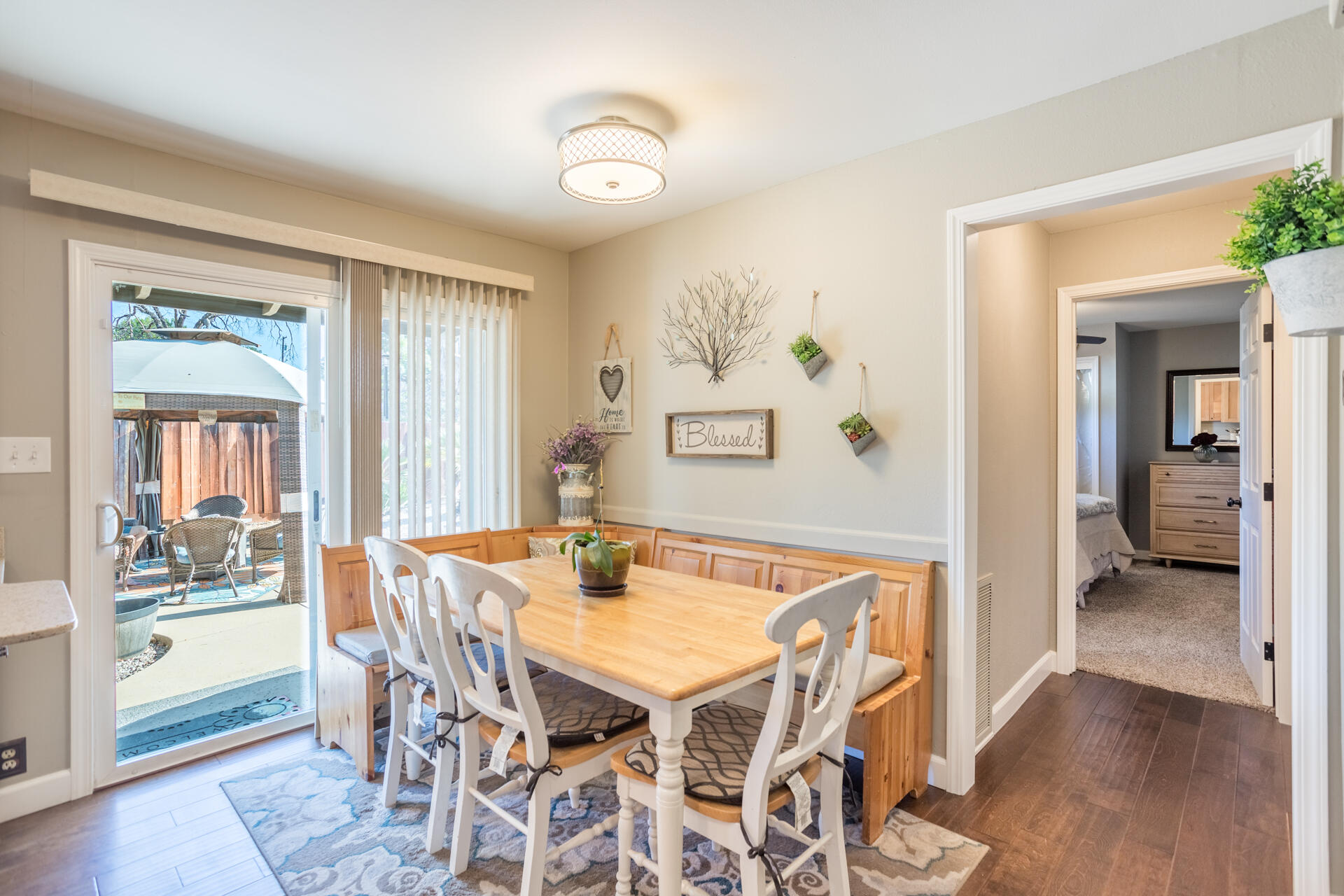 2766 Robert Court Redding, CA 96002 - Photo 10 of 28 a view of a dining room with furniture and wooden floor