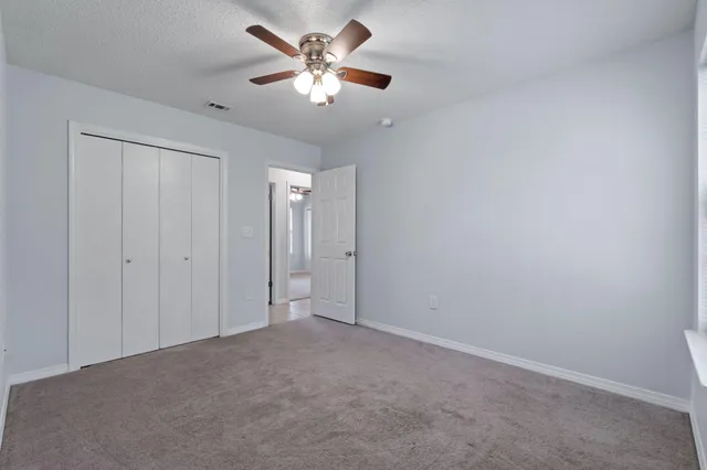 a bathroom with a bath tub with a shower