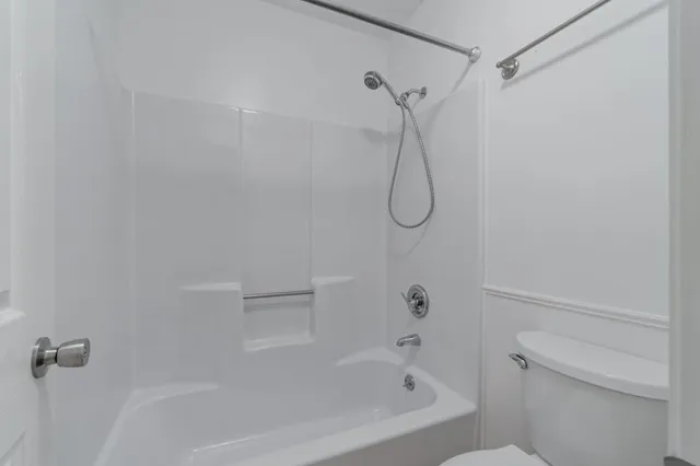 an empty room with a empty space and a ceiling fan