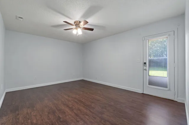 a bathroom with a granite countertop sink a mirror and a vanity