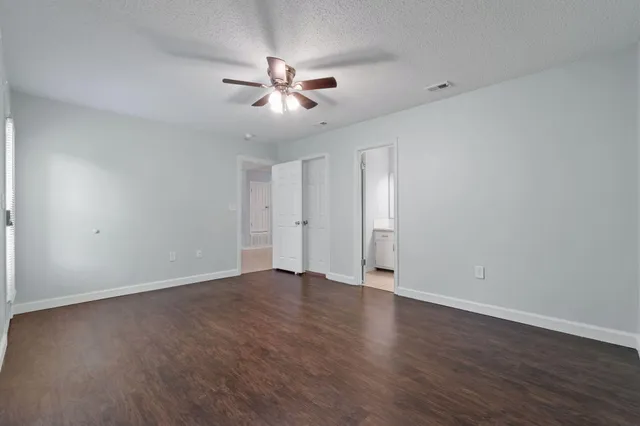 a white bath tub sitting next to a white toilet