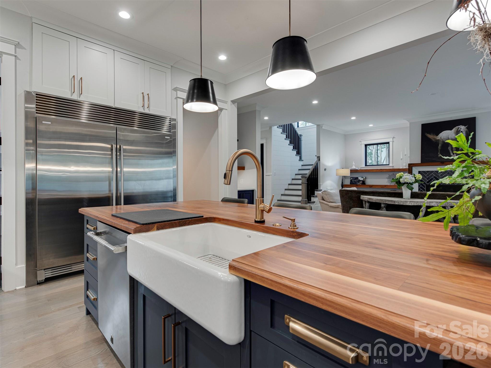 4009 Ridgecrest Avenue Charlotte, NC 28211 - Photo 13 of 43 a kitchen with stainless steel appliances granite countertop a sink a stove and a refrigerator