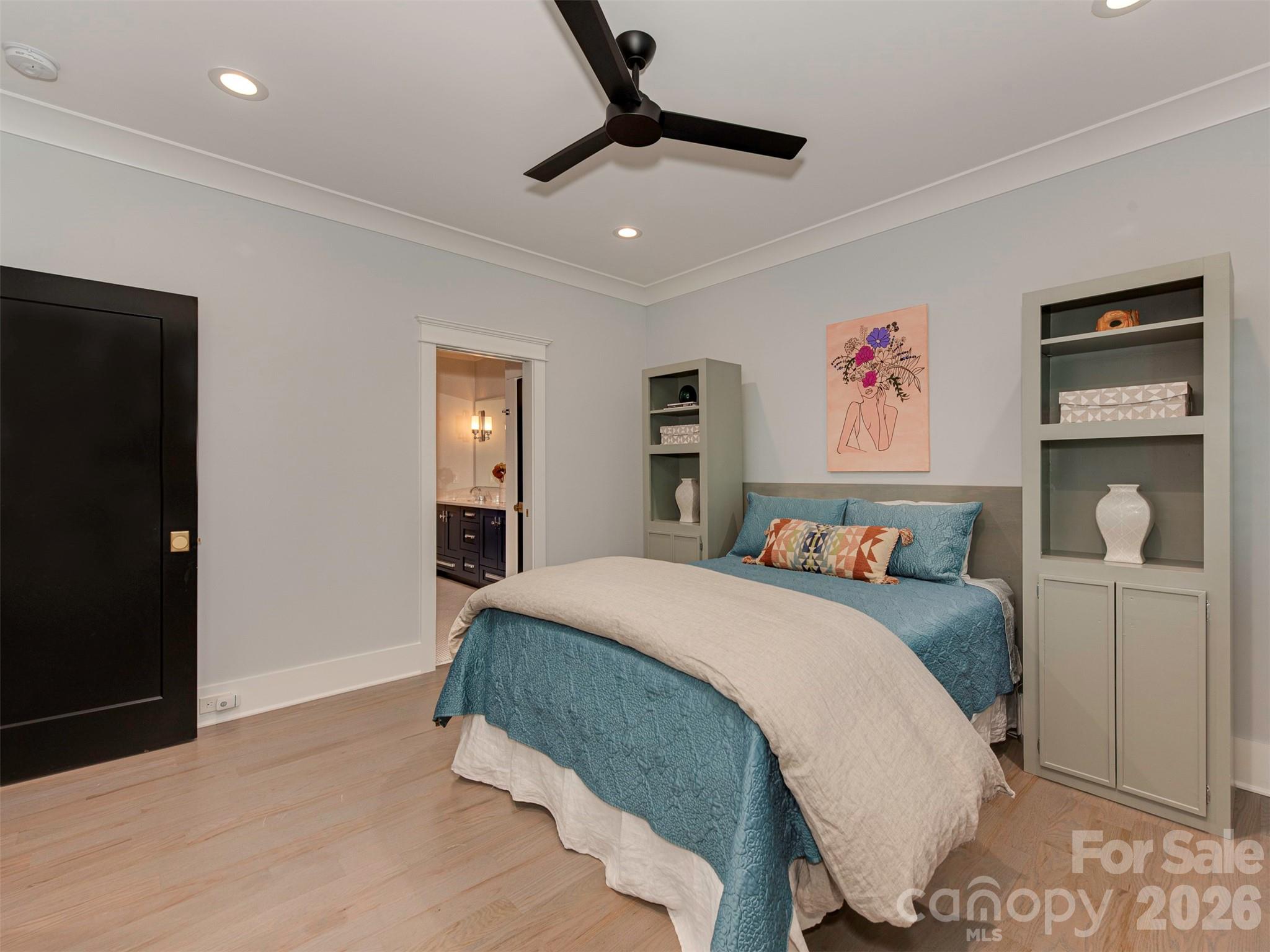 4009 Ridgecrest Avenue Charlotte, NC 28211 - Photo 27 of 43 a bedroom with a bed and painting on the wall