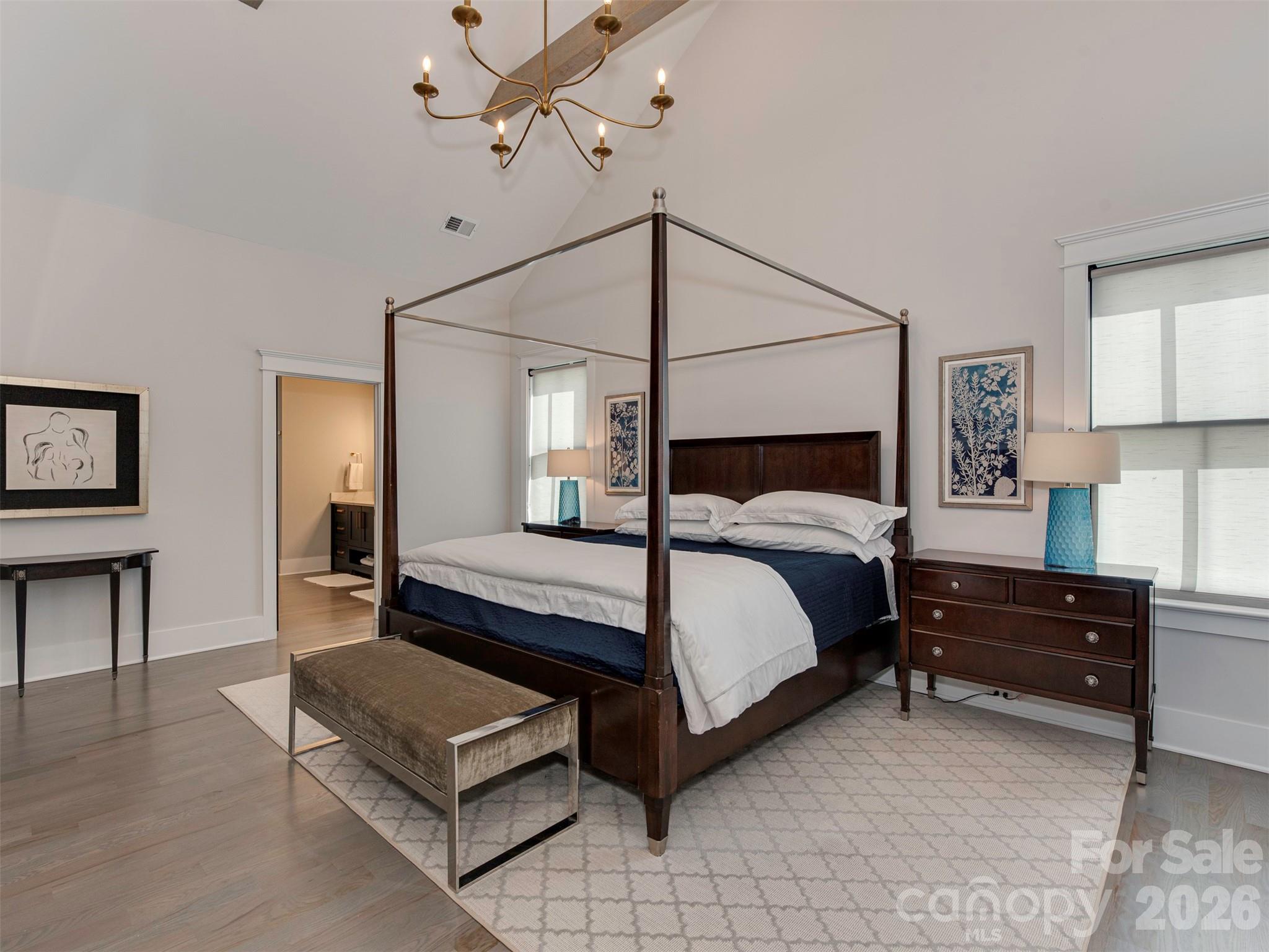 4009 Ridgecrest Avenue Charlotte, NC 28211 - Photo 31 of 43 a bedroom with a bed lamp and a potted plant