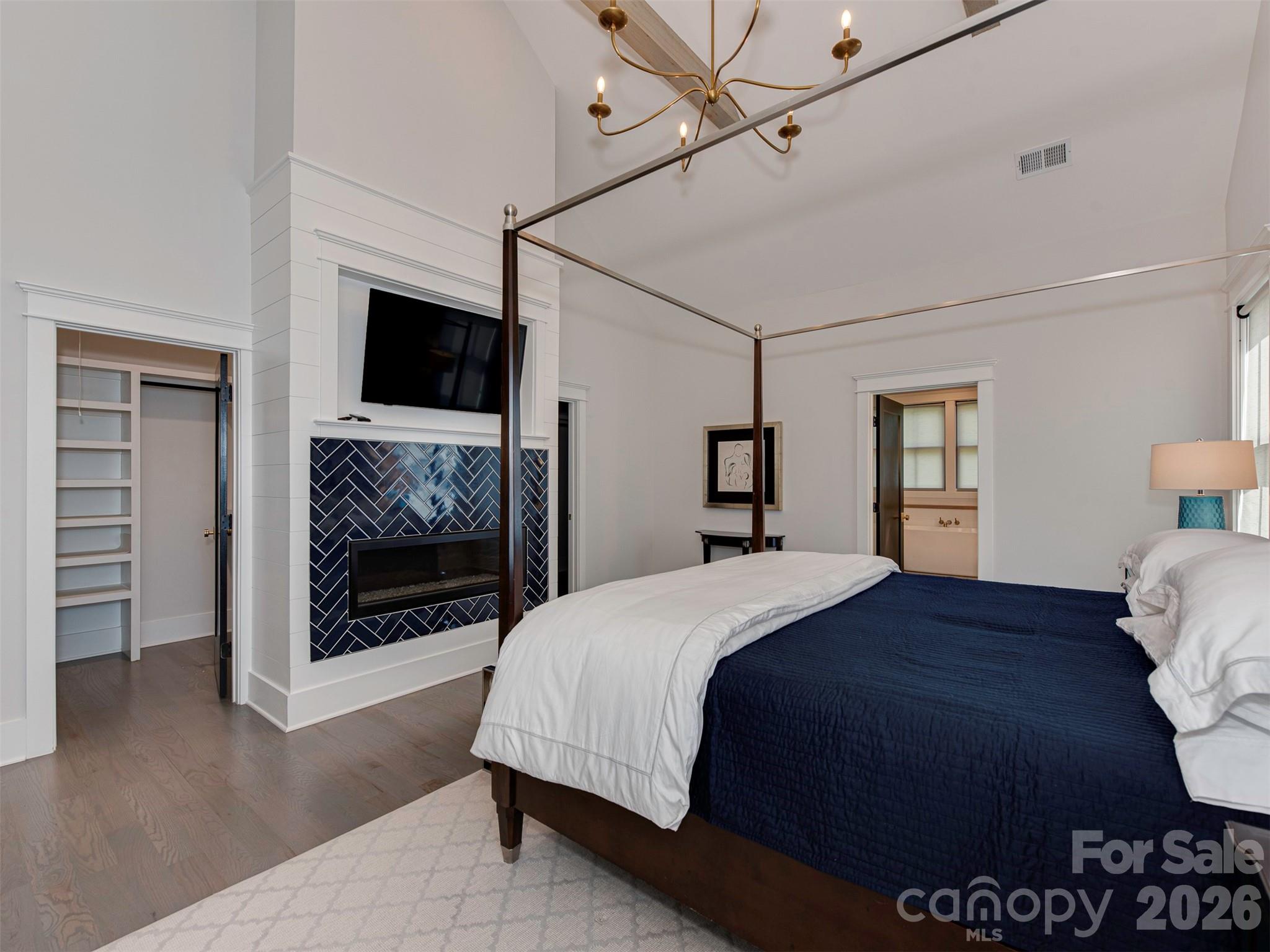 4009 Ridgecrest Avenue Charlotte, NC 28211 - Photo 32 of 43 a bedroom with a bed and a television