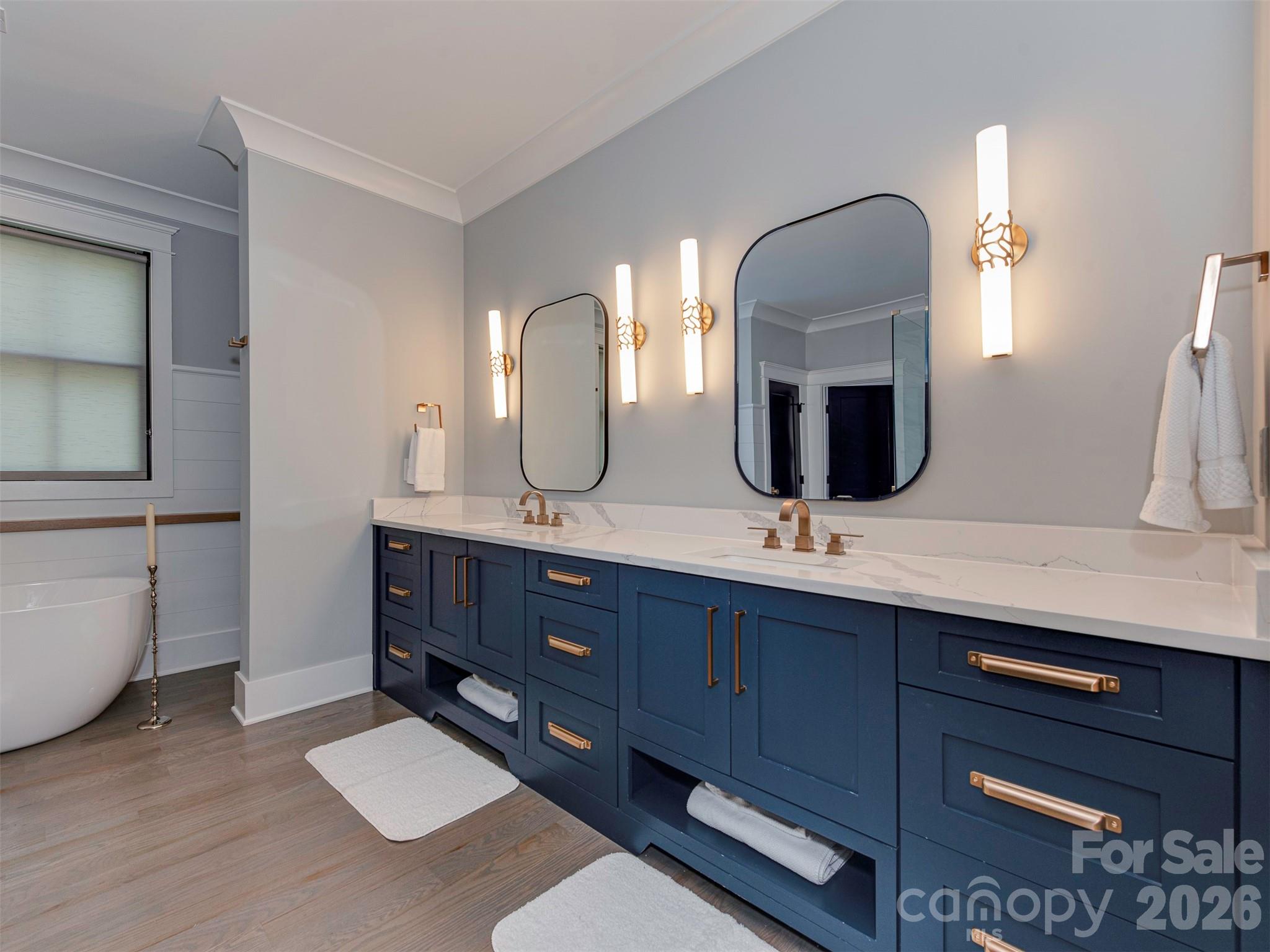4009 Ridgecrest Avenue Charlotte, NC 28211 - Photo 35 of 43 a bathroom with a double vanity sink and a mirror