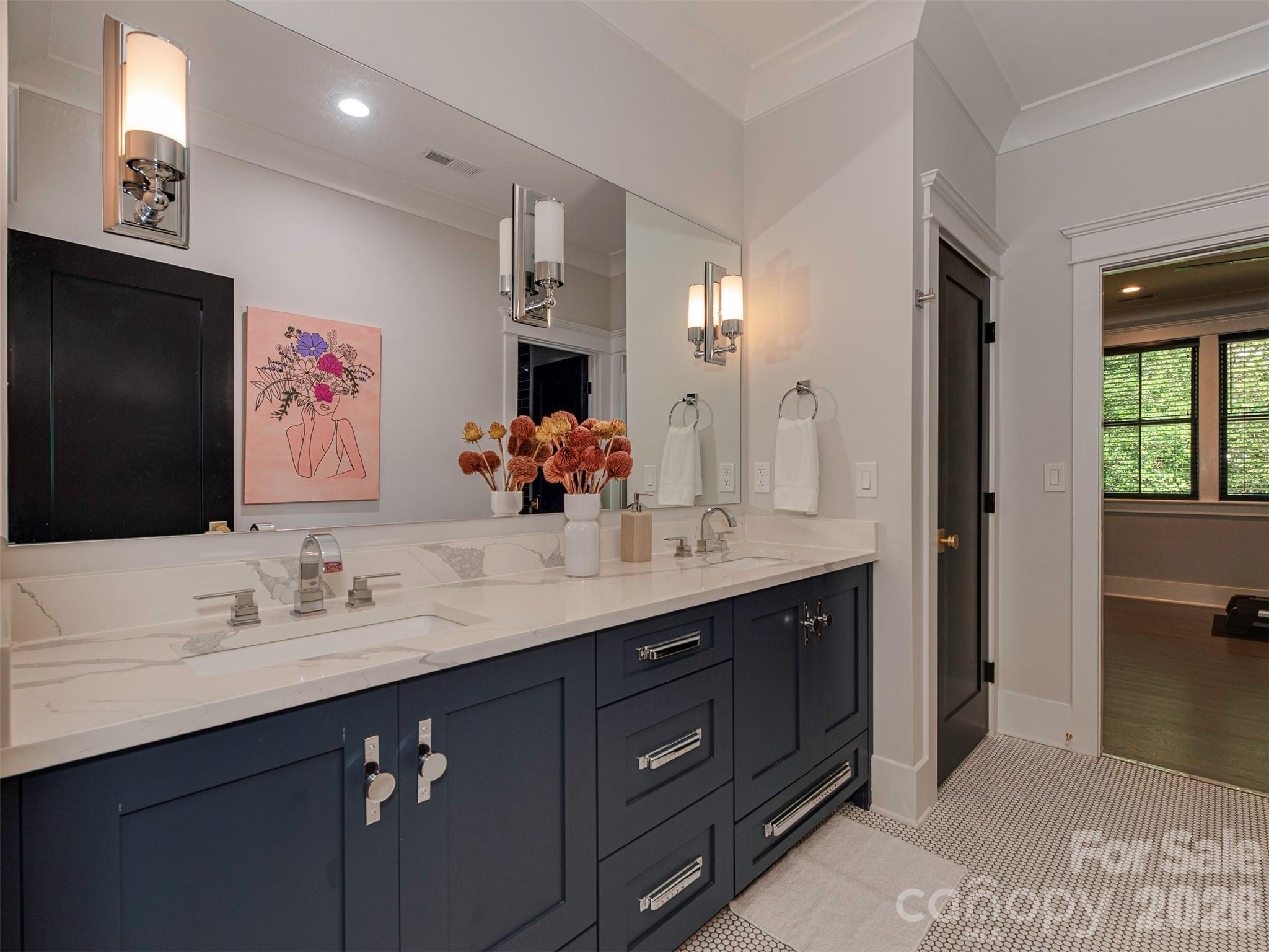 4009 Ridgecrest Avenue Charlotte, NC 28211 - Photo 40 of 43 a bathroom with a double vanity sink and a mirror