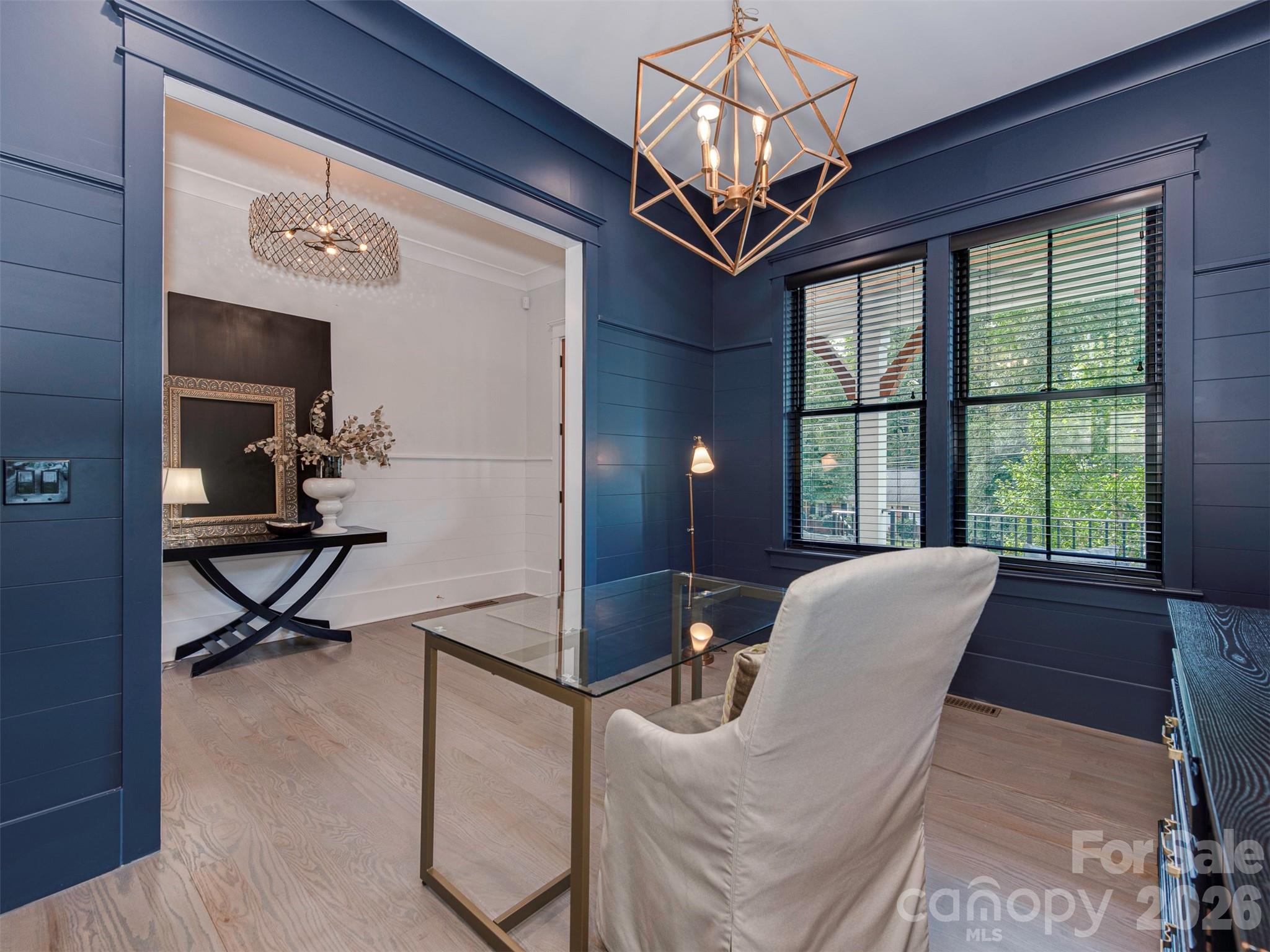 4009 Ridgecrest Avenue Charlotte, NC 28211 - Photo 4 of 43 a view of a livingroom with furniture and a chandelier