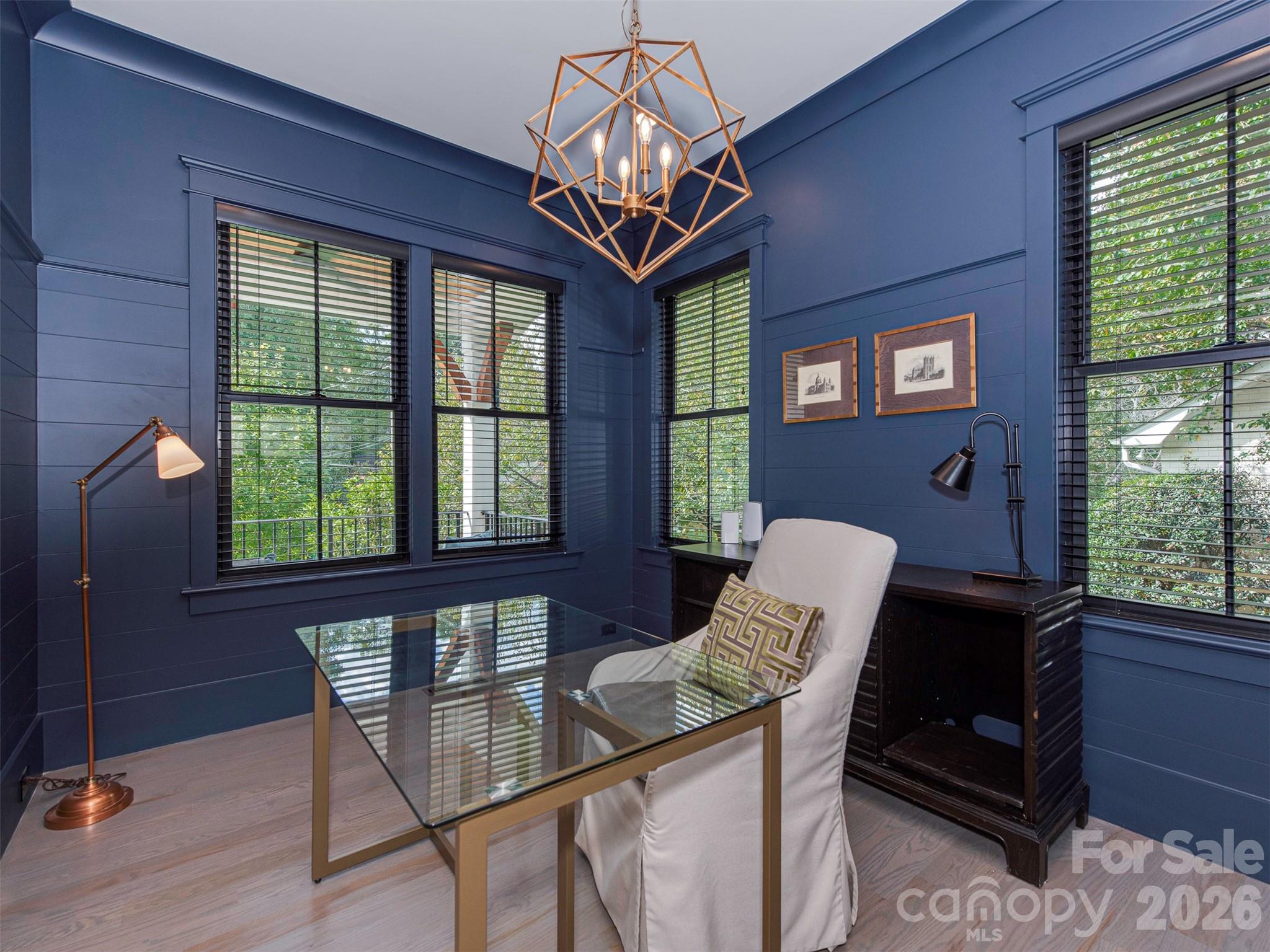 4009 Ridgecrest Avenue Charlotte, NC 28211 - Photo 42 of 43 a view of a dining room with furniture a chandelier and window
