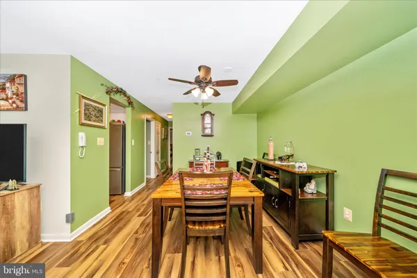 a dining room with furniture and a chandelier