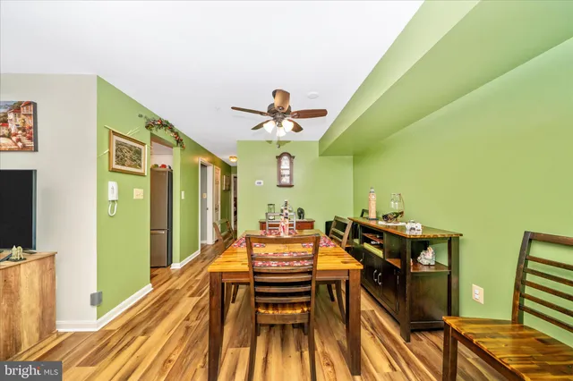 a dining room with furniture and a chandelier