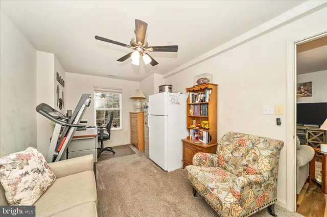 a view of a livingroom with furniture and a flat screen tv