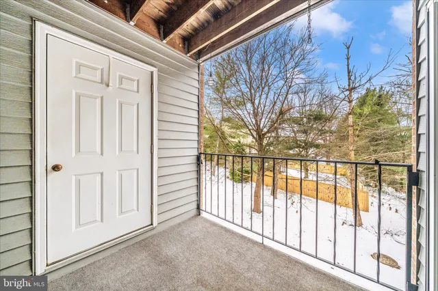 a view of a house with wooden fence
