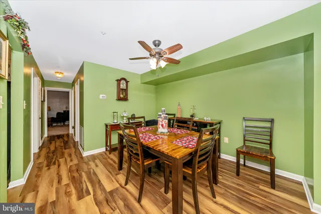 a view of a dining room with furniture and a chandelier