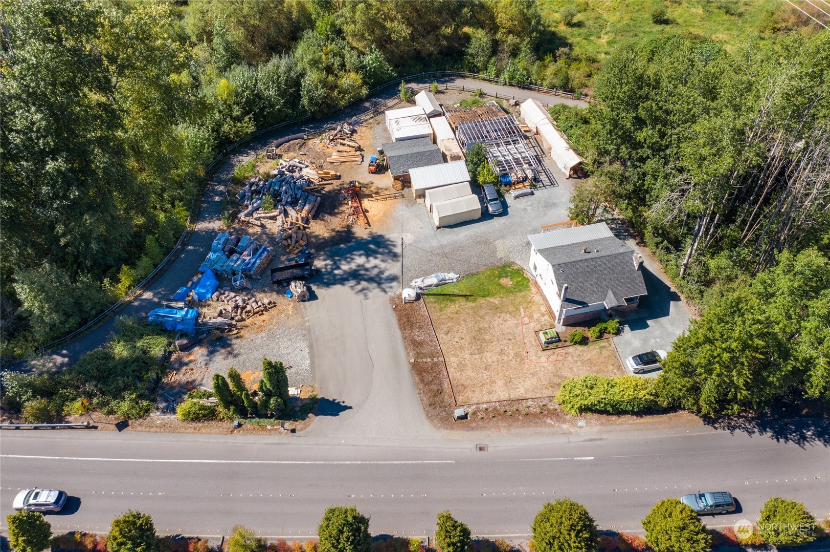 21204 Bothell Everett Highway Bothell, WA 98021 - Photo 2 of 6 an aerial view of a house with a yard and parking spaces