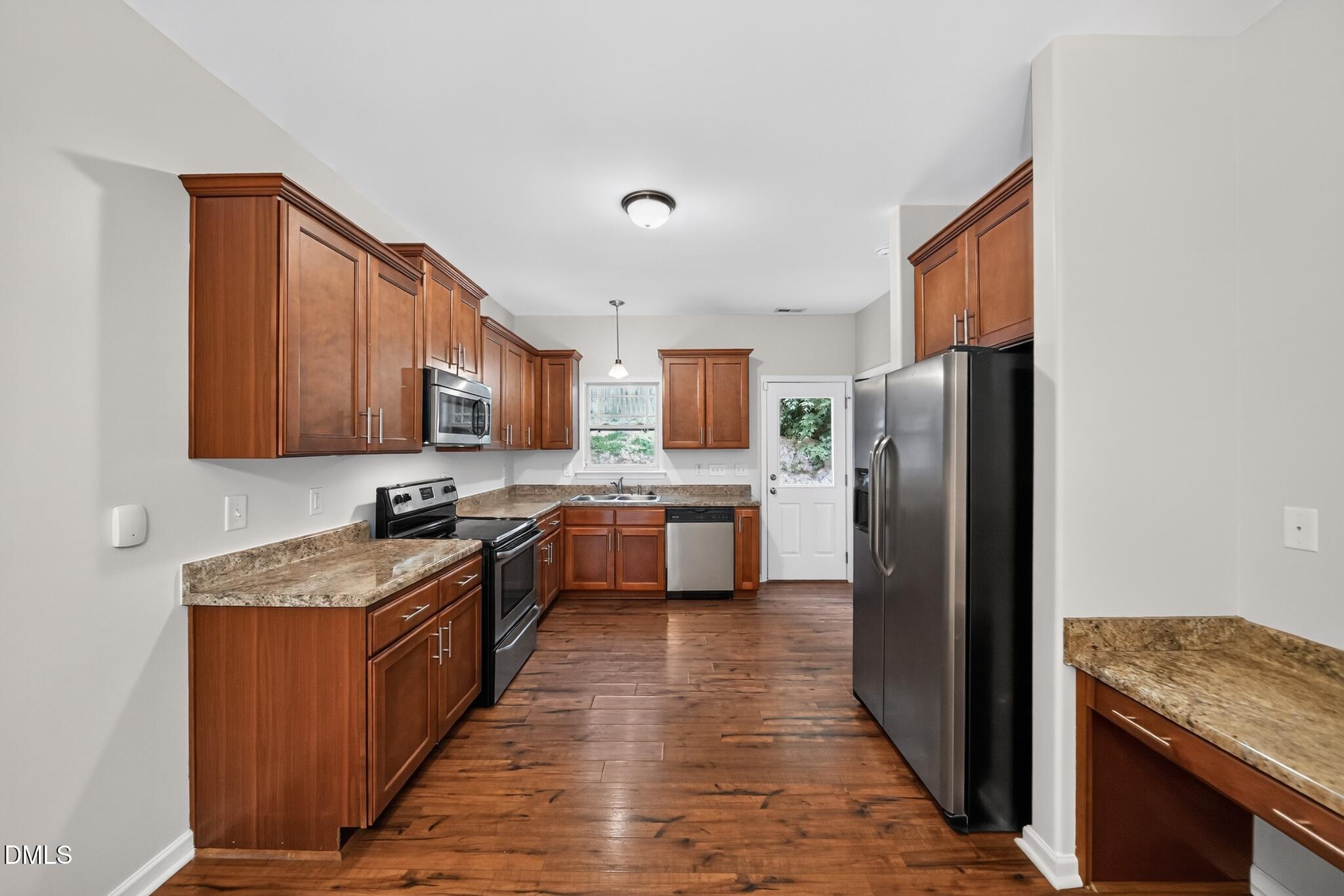 6443 Hatchies Drive Raleigh, NC 27610 - Photo 4 of 19 07_6443_Hatchies_Dr-Kitchen-0702