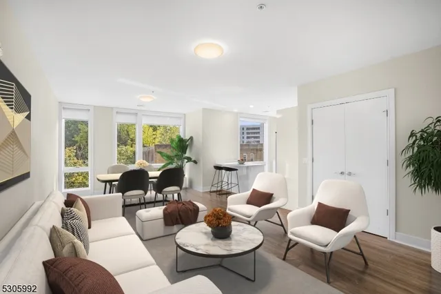 a living room with furniture and a large window