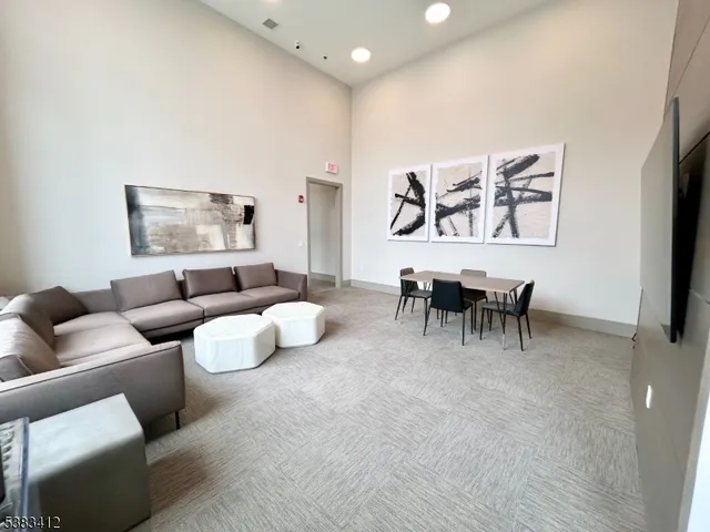 a living room with furniture and white walls