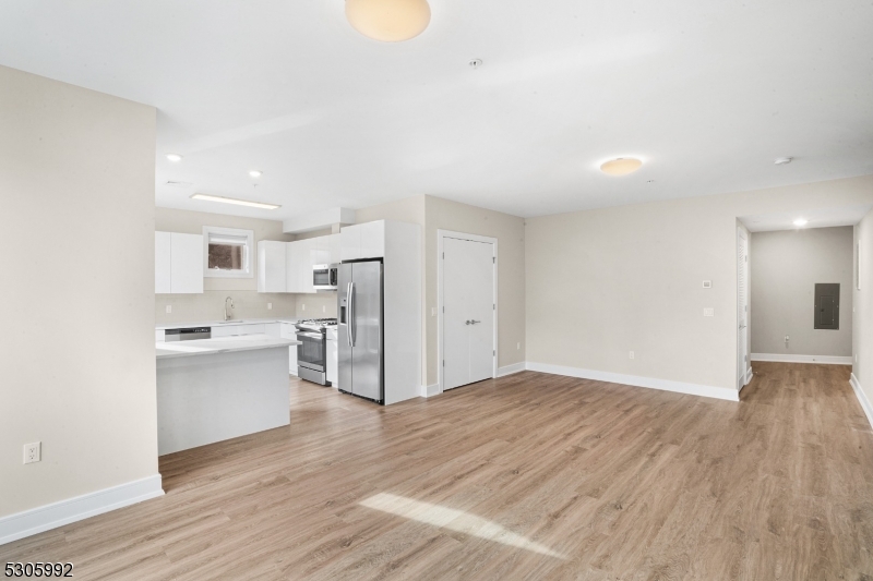42 Spring Street, Unit 203 Morristown, NJ 07960 - Photo 6 of 15 a view of a kitchen with a sink and a refrigerator