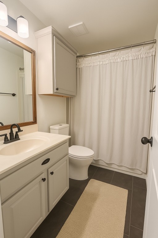 4821 Chesney Ridge Drive Austin, TX 78749 - Photo 14 of 15 a bathroom with a sink a toilet and shower