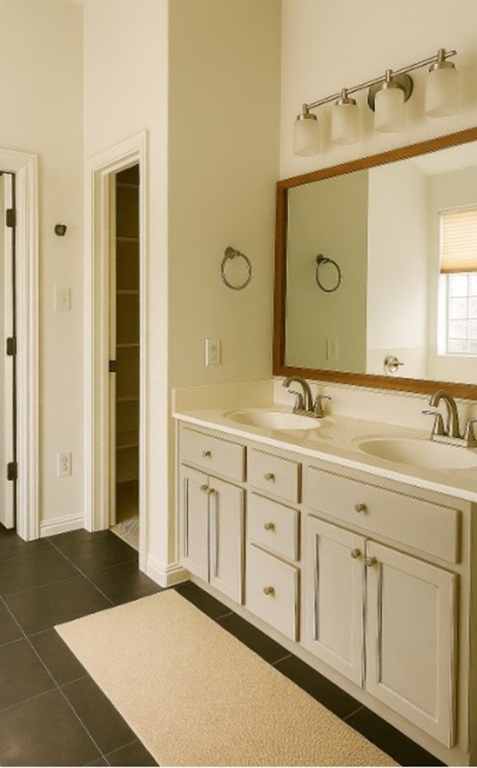 4821 Chesney Ridge Drive Austin, TX 78749 - Photo 8 of 15 a spacious bathroom with a granite countertop sink and a mirror