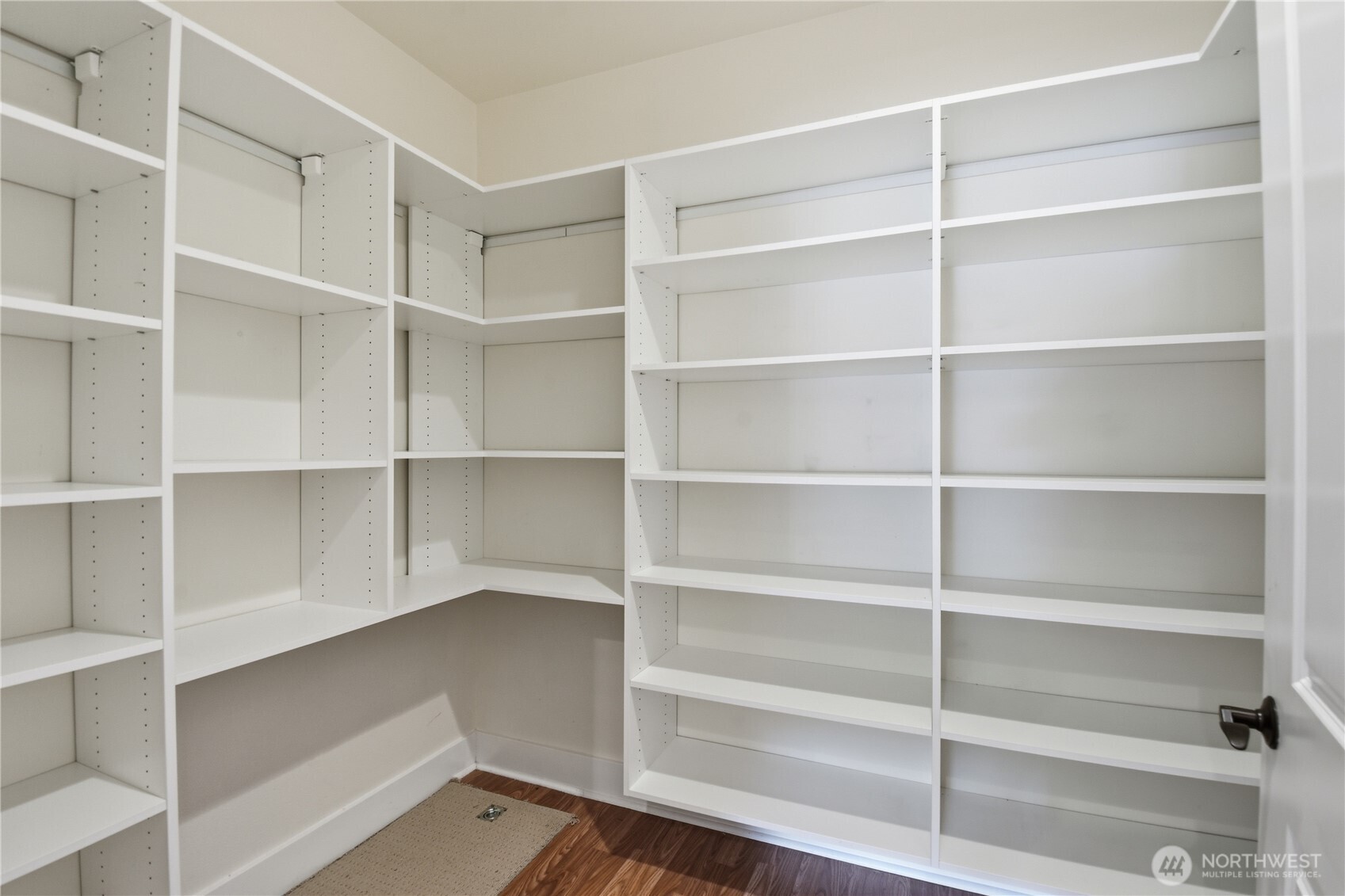 383 Romance Hill Road, Unit C Belfair, WA 98528 - Photo 17 of 25 a view of walk in closet with empty racks