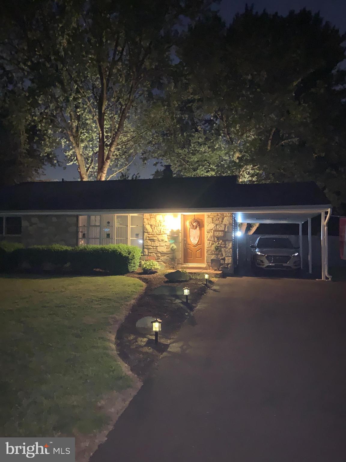 223 West County Line Road Hatboro, PA 19040 - Photo 3 of 38 Front of house at night & uplighting in backyard