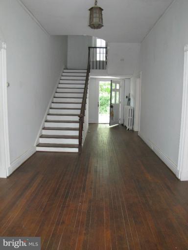 142 Falling Spring Road Shepherdstown, WV 25443 - Photo 14 of 27 a view of empty room with wooden floor and fan