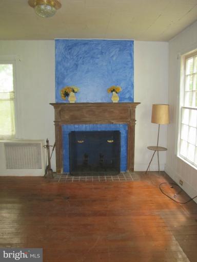 142 Falling Spring Road Shepherdstown, WV 25443 - Photo 10 of 27 a living room with furniture and a fireplace