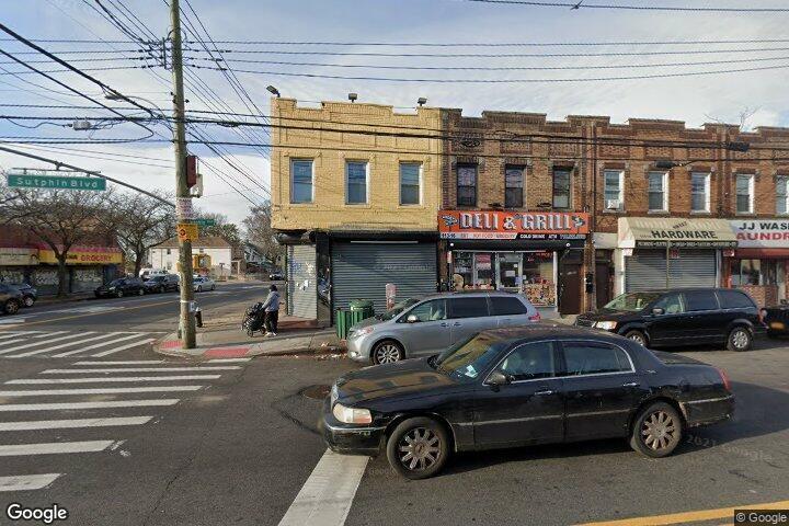 113-18 Sutphin Boulevard Queens, NY 11435 - Photo 1 of 3 a car parked in front of a building